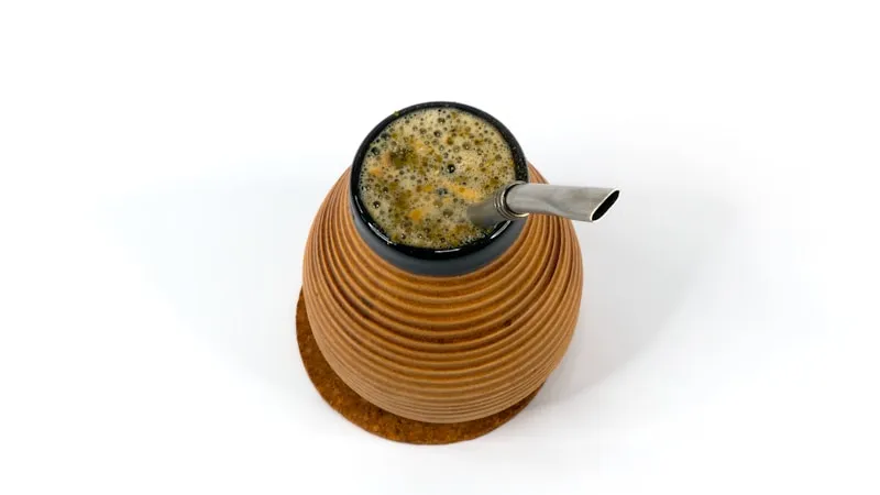 A dark ceramic mug of strong black tea