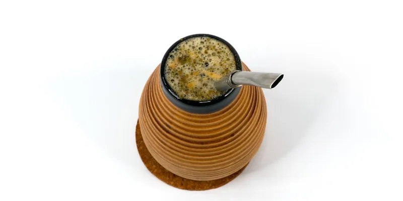 A dark ceramic mug of strong black tea