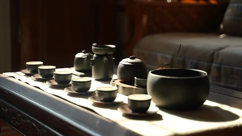 Tea cups arranged on a wooden table, like a royal pour